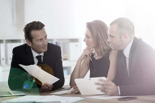 A stakeholder team meeting to evaluate a CRM decision