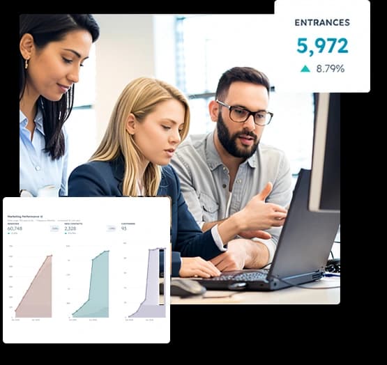 A team collaborating around a laptop