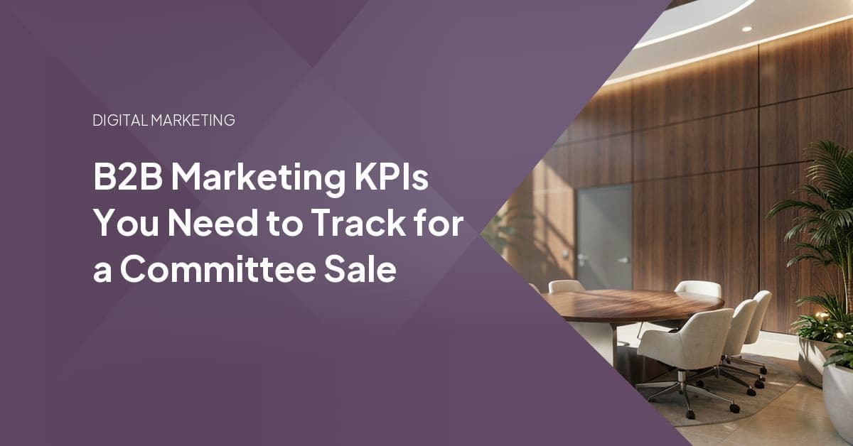 A sleek, high-ceilinged lobby features a large, circular conference table surrounded by comfortable, minimalist seating areas.