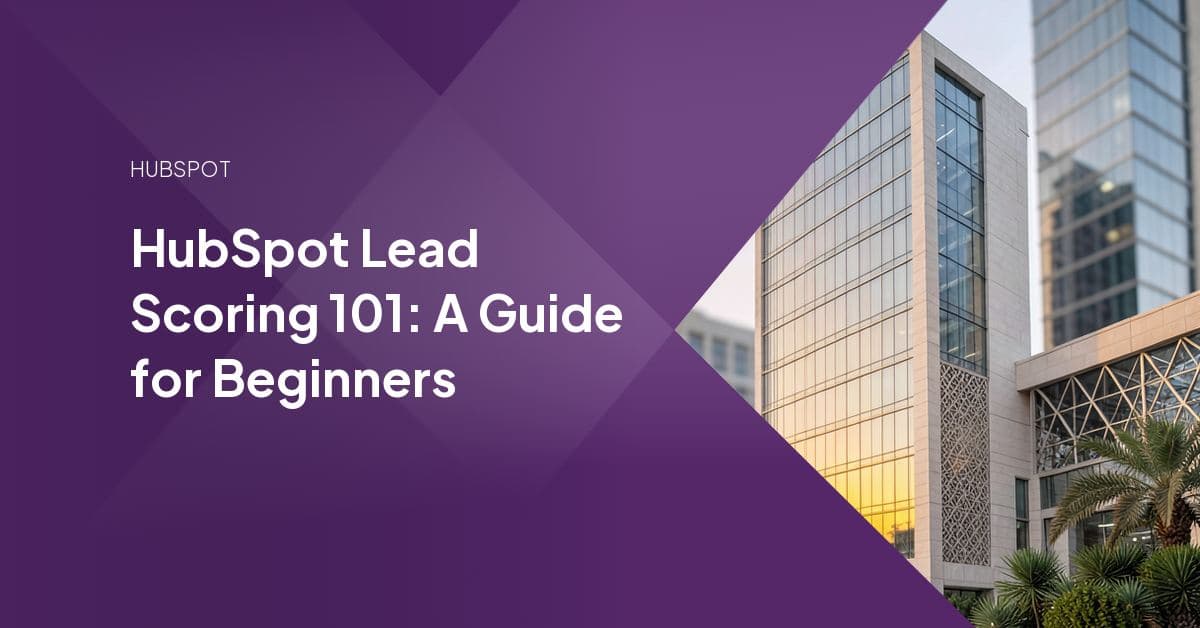 A sleek glass high-rise building stands alone at dusk, its façade reflecting warm golden light, with a subtle gradient of pastel hues behind it.