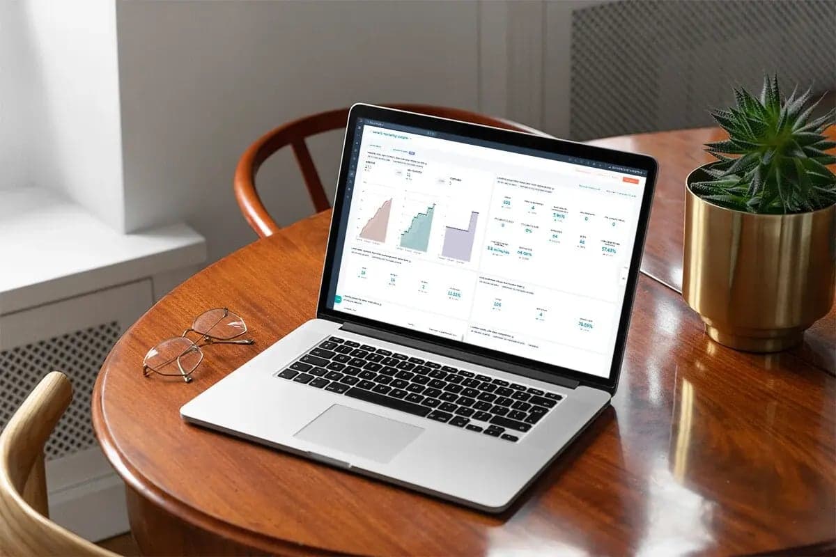 Laptop on a desk displaying a live operations dashboard
