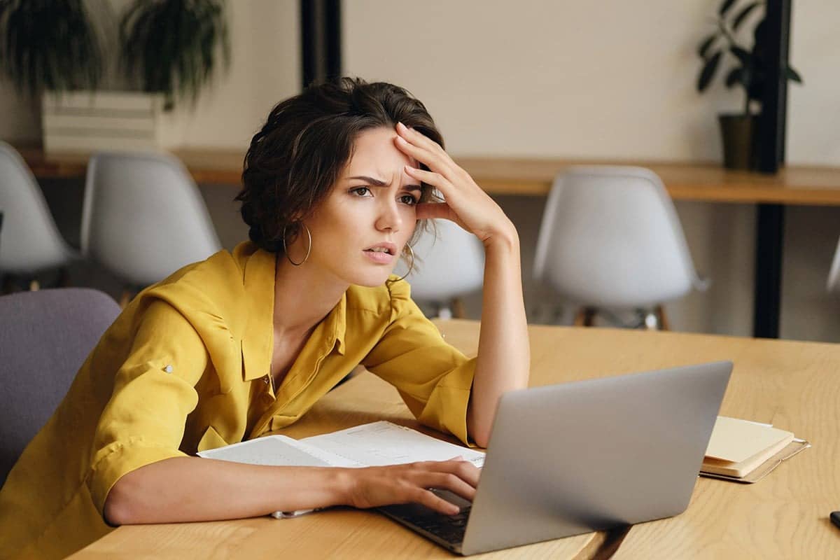 Struggling marketer at a computer